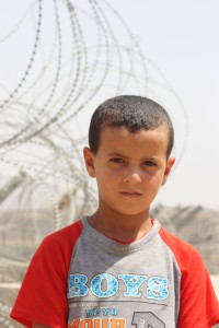 Life in the enclaves: A Palestinian boy at Beit Ijza.